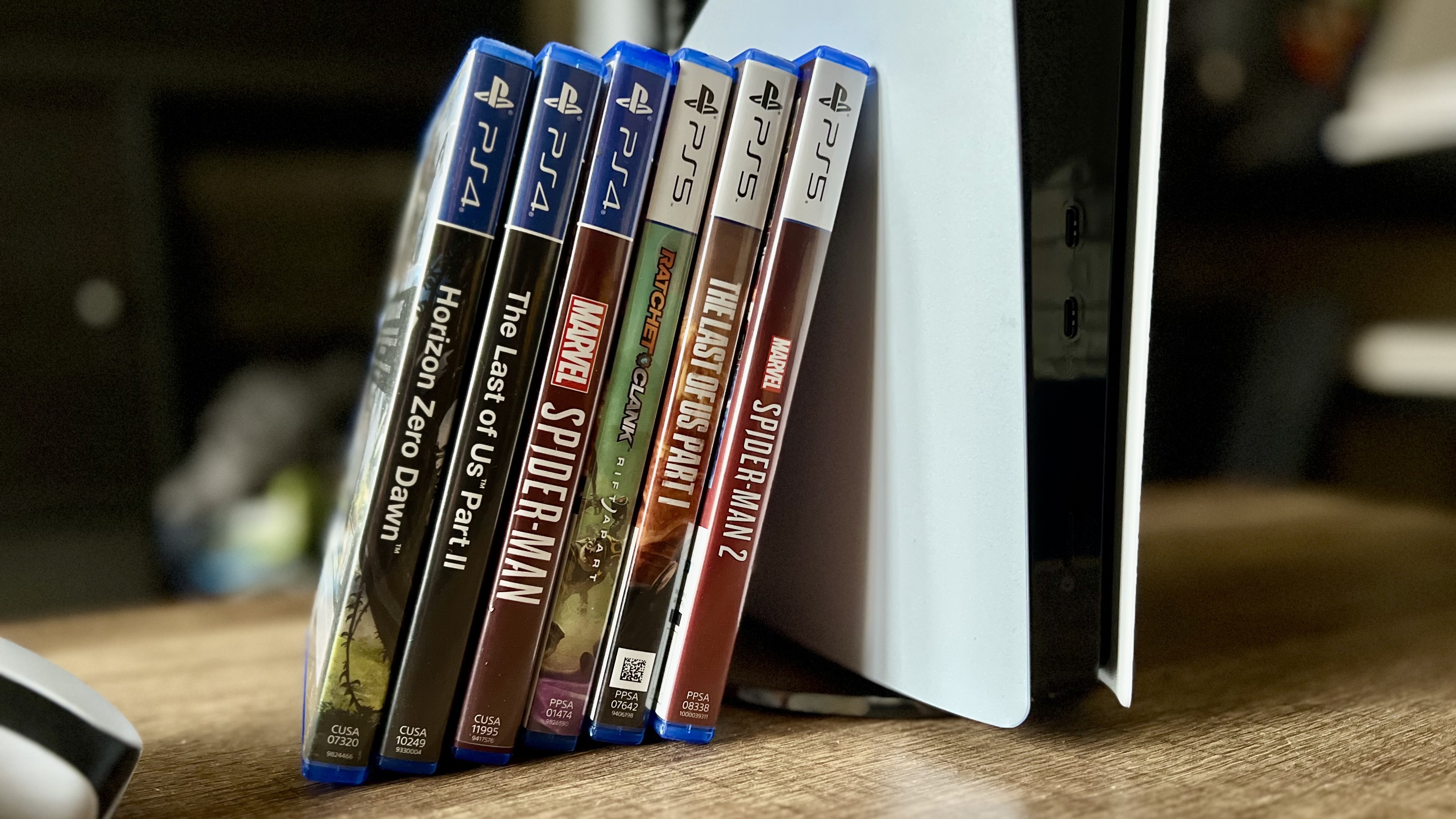 PS5 games leaning against a PS5 Pro