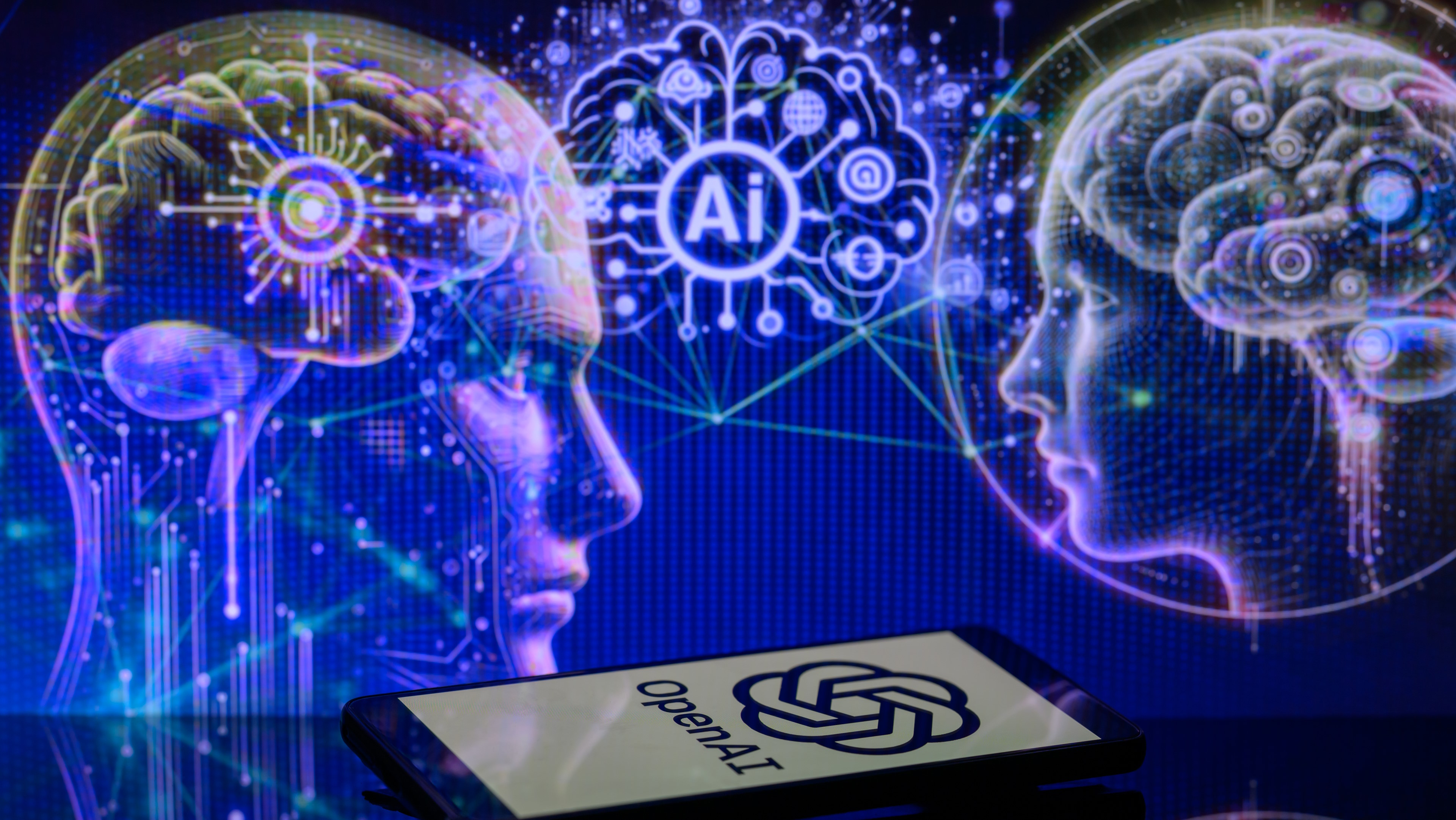 3r2ecljwznwfep7tkkphpc The OpenAI logo is being displayed on a smartphone with an AI brain visible in the background, in this photo illustration taken in Brussels, Belgium, on January 2, 2024. (Photo illustration by Jonathan Raa/NurPhoto via Getty Images)