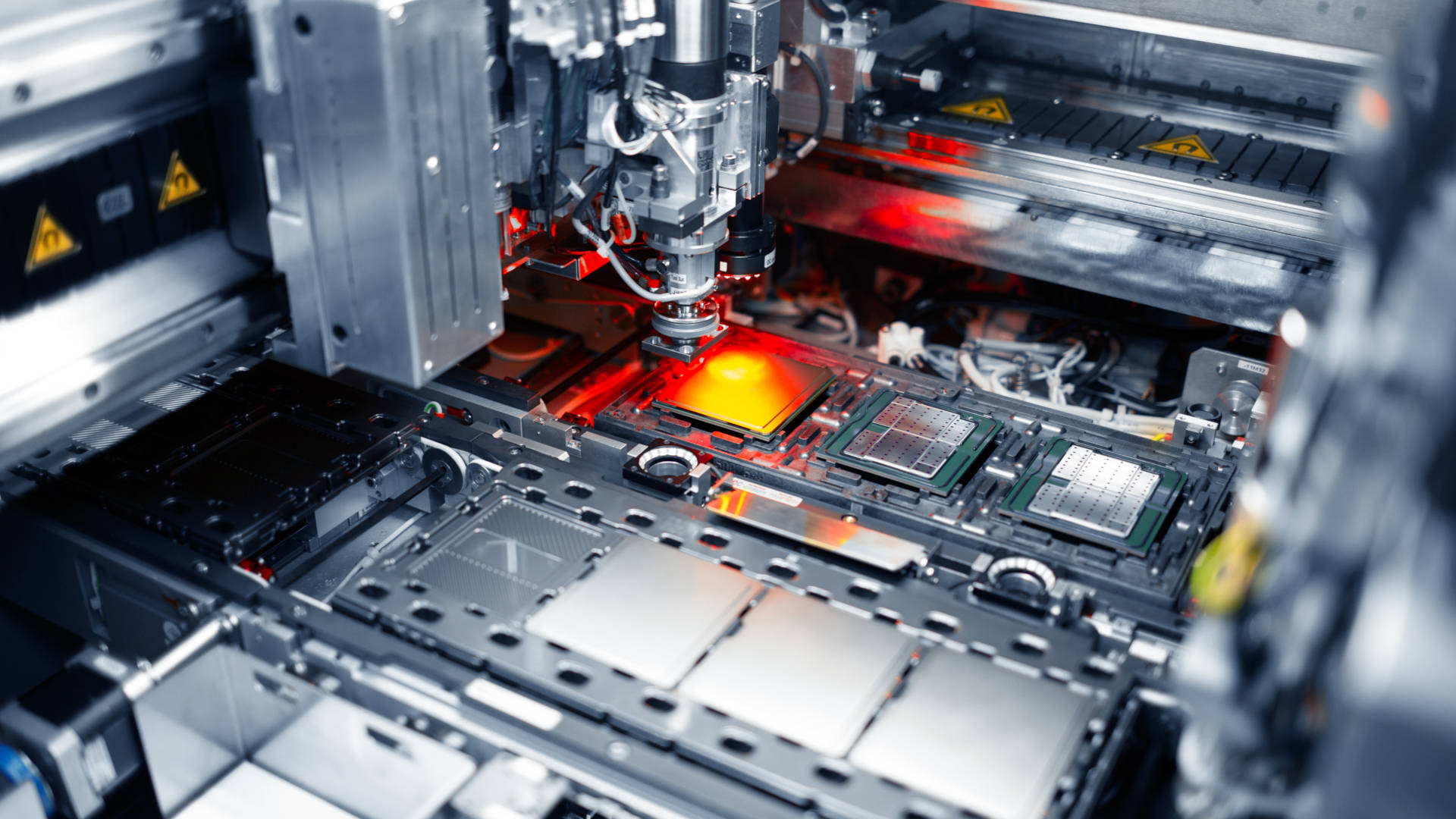 photo shows a factory tool that places lids on data center system-on-chips at an Intel fab in Chandler, Arizona, in December 2023. In February 2024, Intel Corporation launched Intel Foundry as the world’s first systems foundry for the AI era, delivering leadership in technology, resiliency and sustainability.