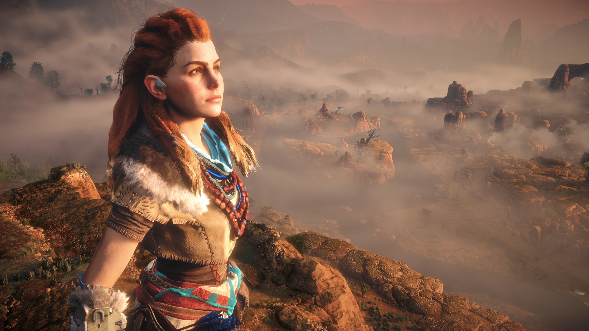 A close-up shot of Aloy standing on a misty cliff during Horizon Zero Dawn, one of the best games like Skyrim.