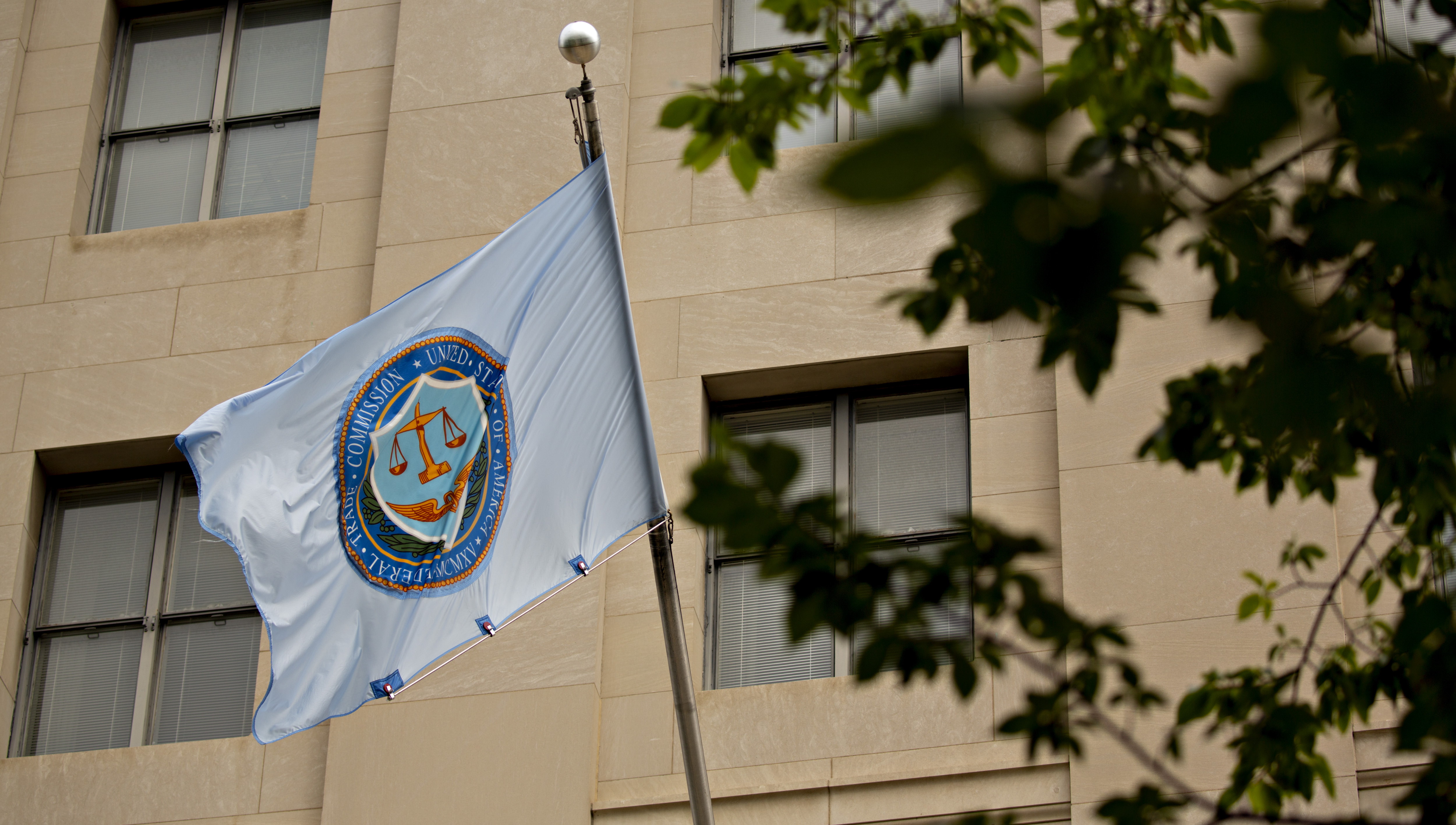 A U.S. Federal Trade Commission (FTC) flag flies outside the headquarters in Washington, D.C., U.S., on Thursday, Aug. 15, 2019.