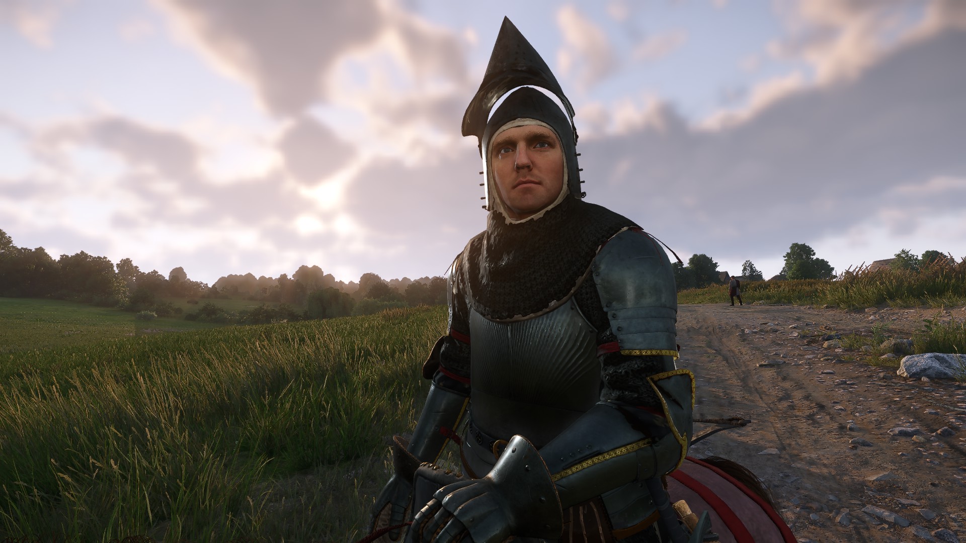 Kingdom Come Deliverance 2 barbers change hairstyle - Henry sitting on a horse wearing armour.