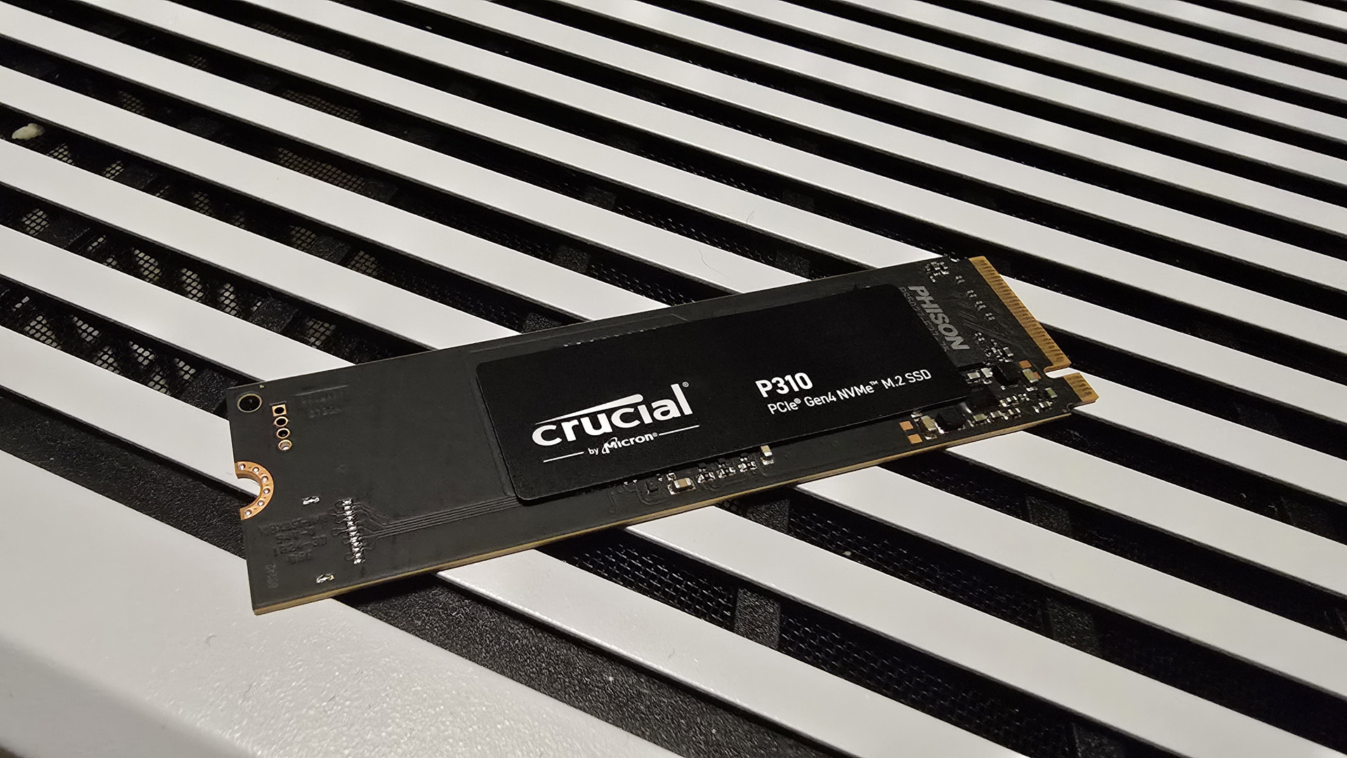 A Crucial P310 SSD installed inside a gaming PC.