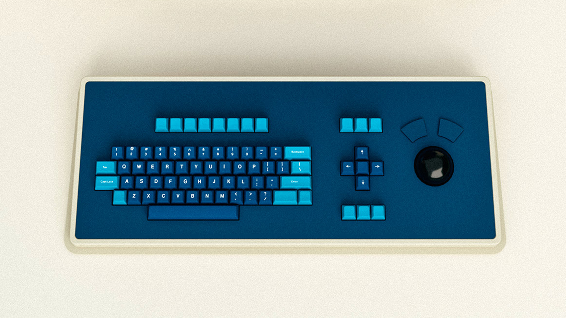 The MDR Dasher Keyboard by Atomic Keyboards sits on a plain white desk. The frame is white, the top panel is navy, the keys are both navy and a lighter blue. The board also features a glossy black trackball on the right hand side.