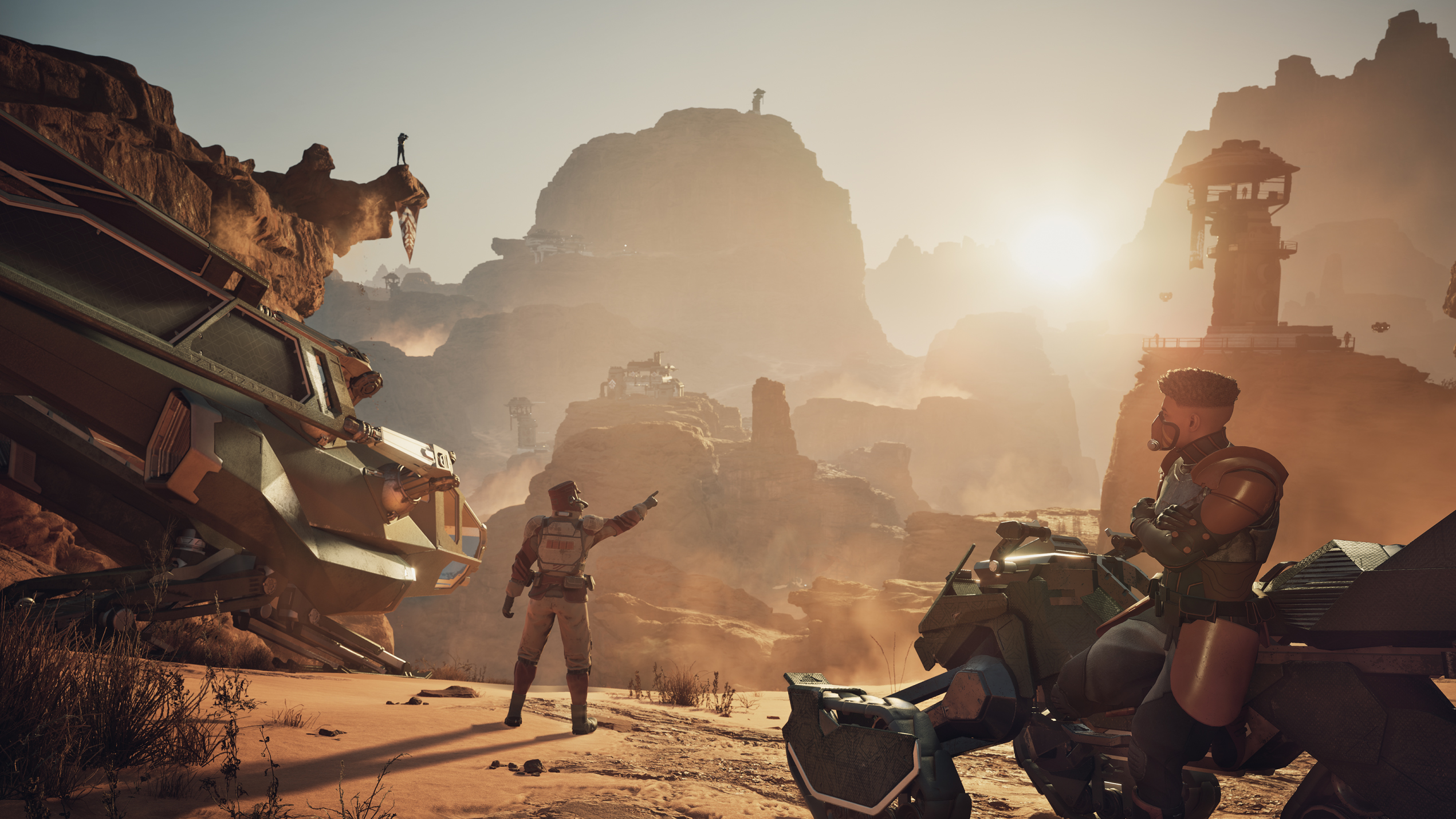 Characters in Dune near a landscape of rocks and hills