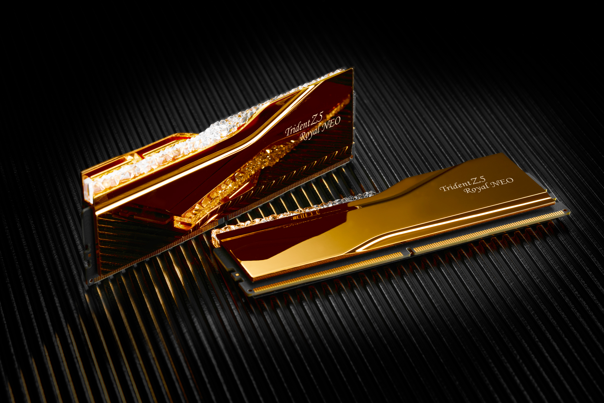 A pair of G.Skill DDR5-8000 CL44 memory modules in gold, on a black textured background