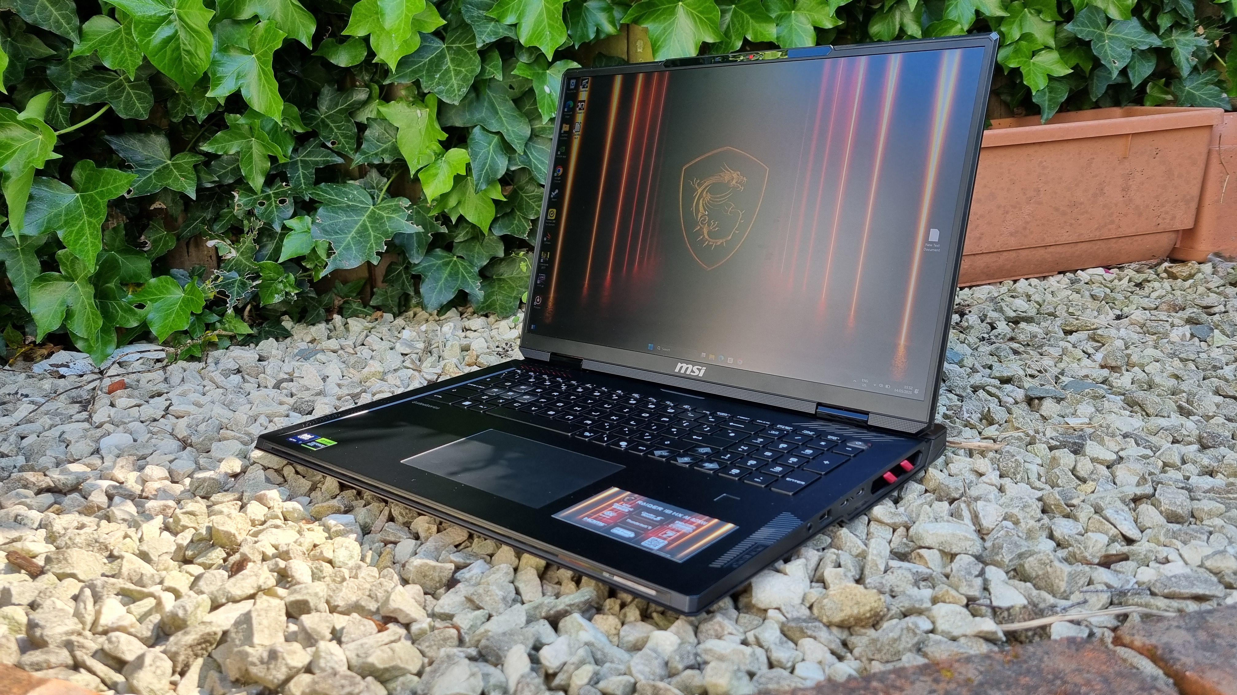 The MSI Raider 19 HX AI A2XW outside on white gravel
