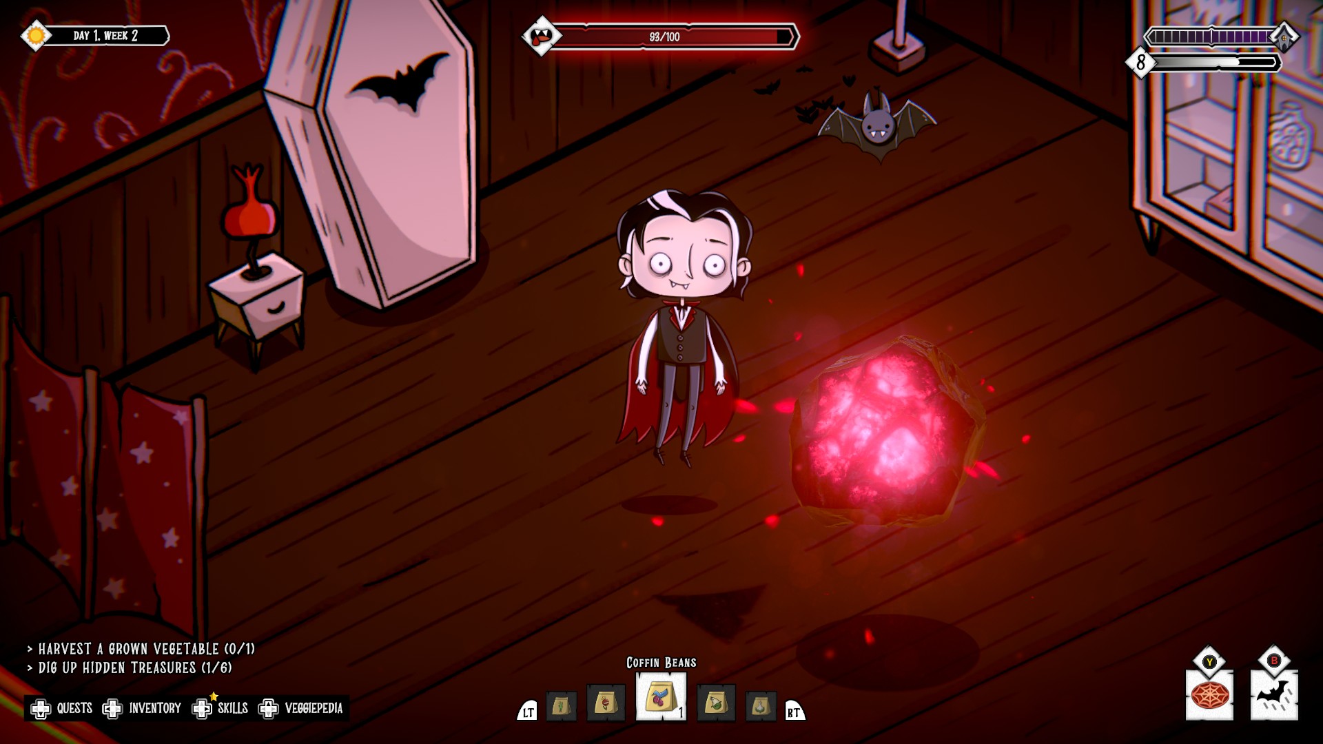 Voltaire the Vegan Vampire floating next to his coffin and red glowing ball during Voltaire the Vegan Vampire.