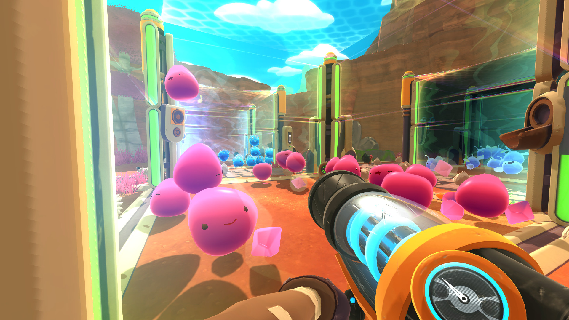 A player shooting pink slims into a corral during Slime Rancher.