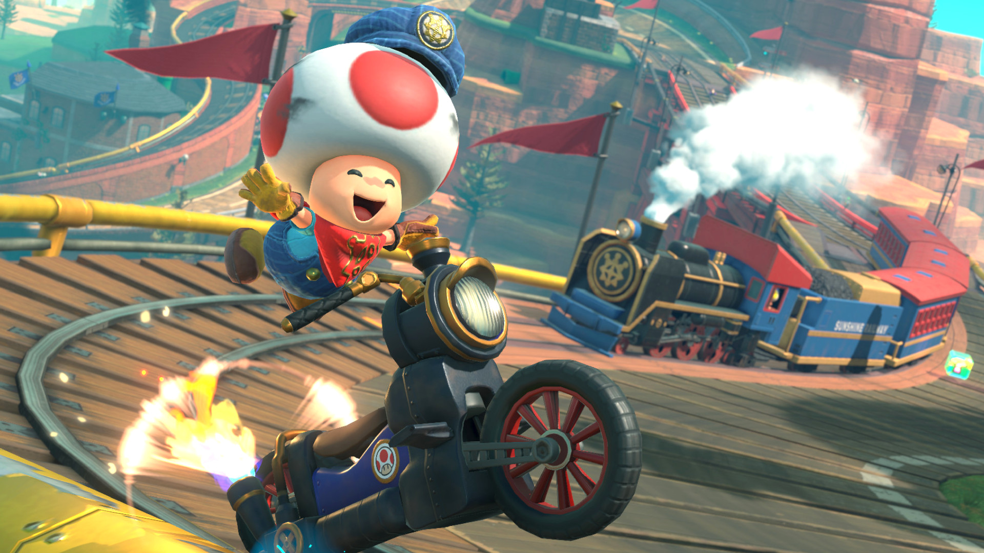 Best Switch 2 games: Toad smiling while racing on a train track during Mario Kart World.