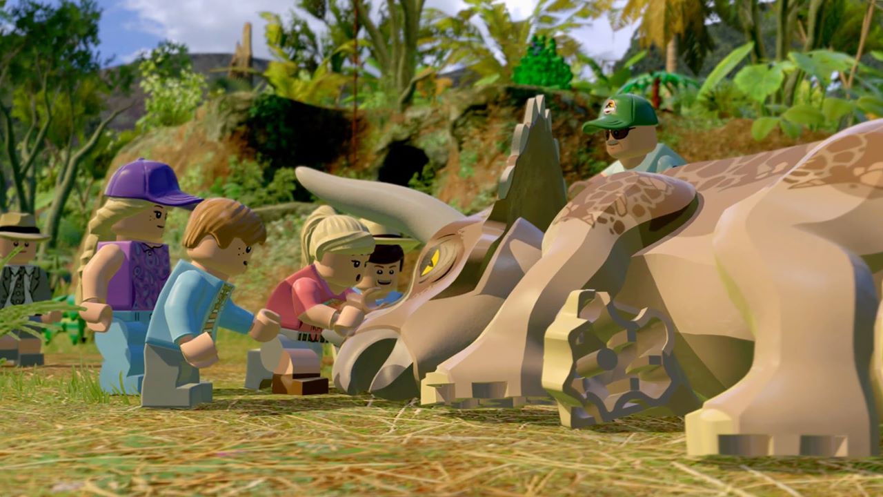 Lego characters touching a dinosaur during Lego Jurassic World.
