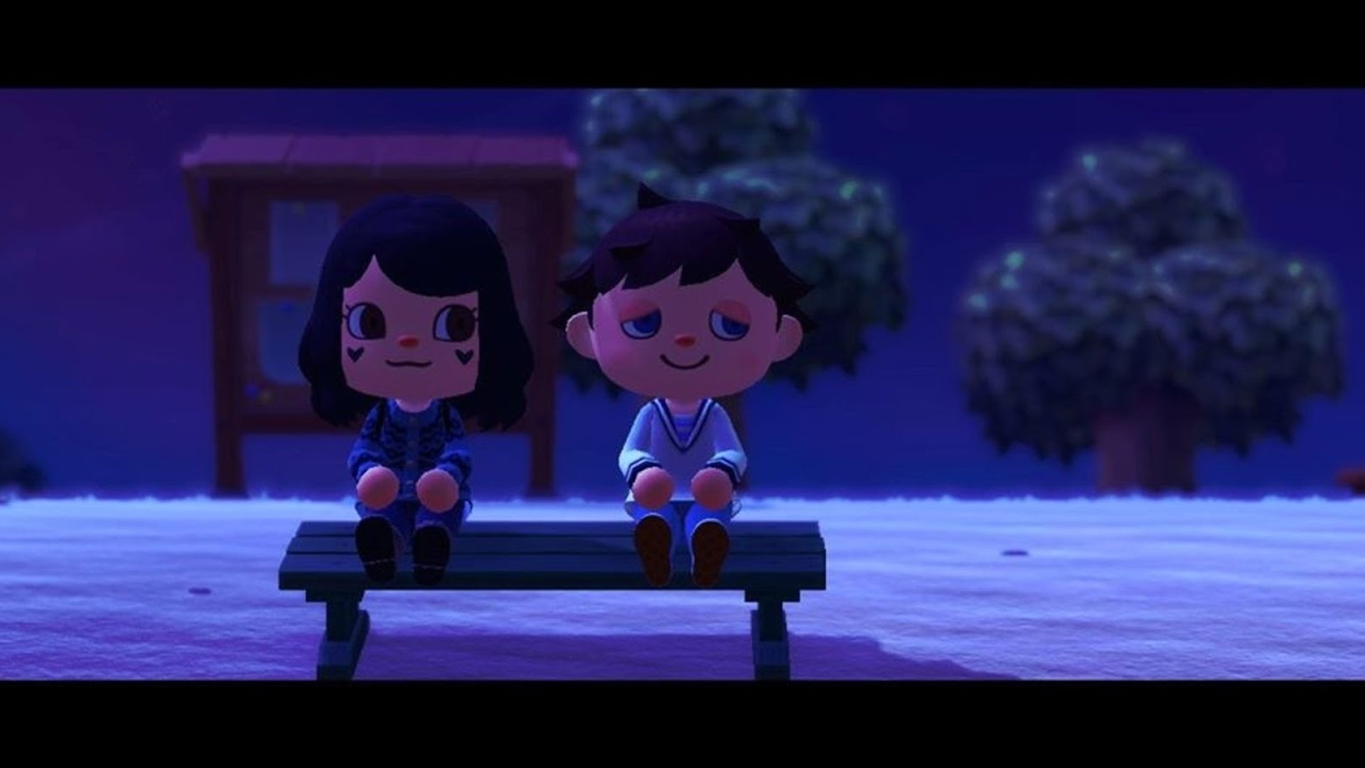Two villagers sitting on a bench during the relaxing game, Animal Crossing: New Horizons.