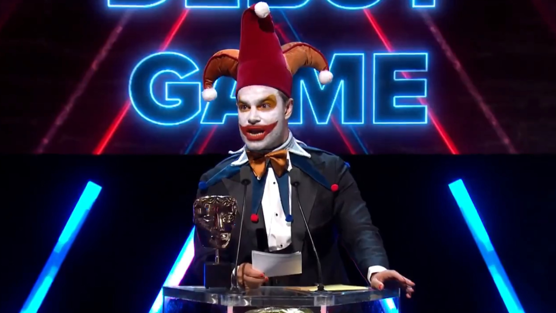 Ben starr dressed as jimbo the joker on the bafta podium accepting an award for balatro