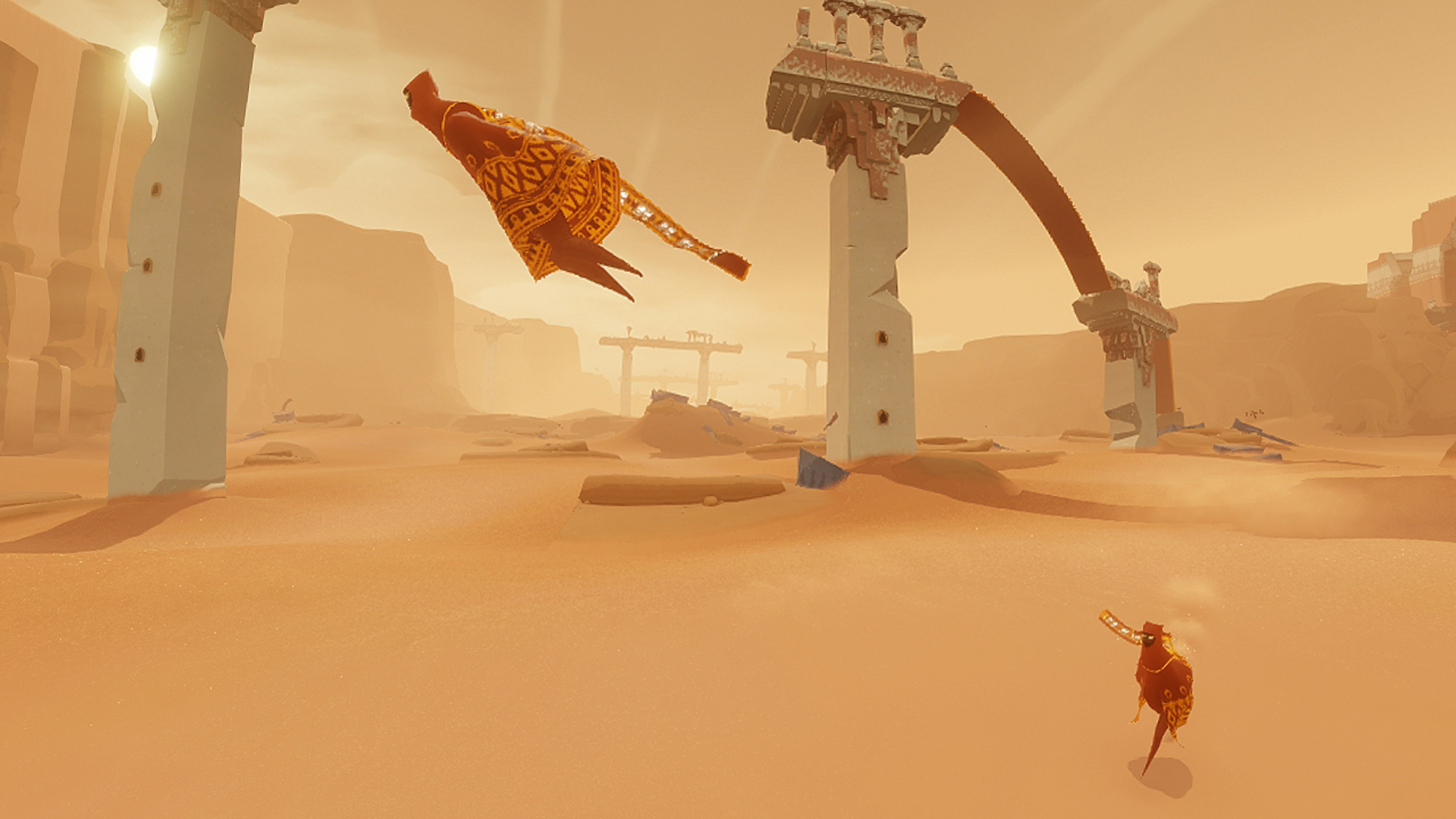 A player walking along the sand during one of the best relaxing games, Journey.