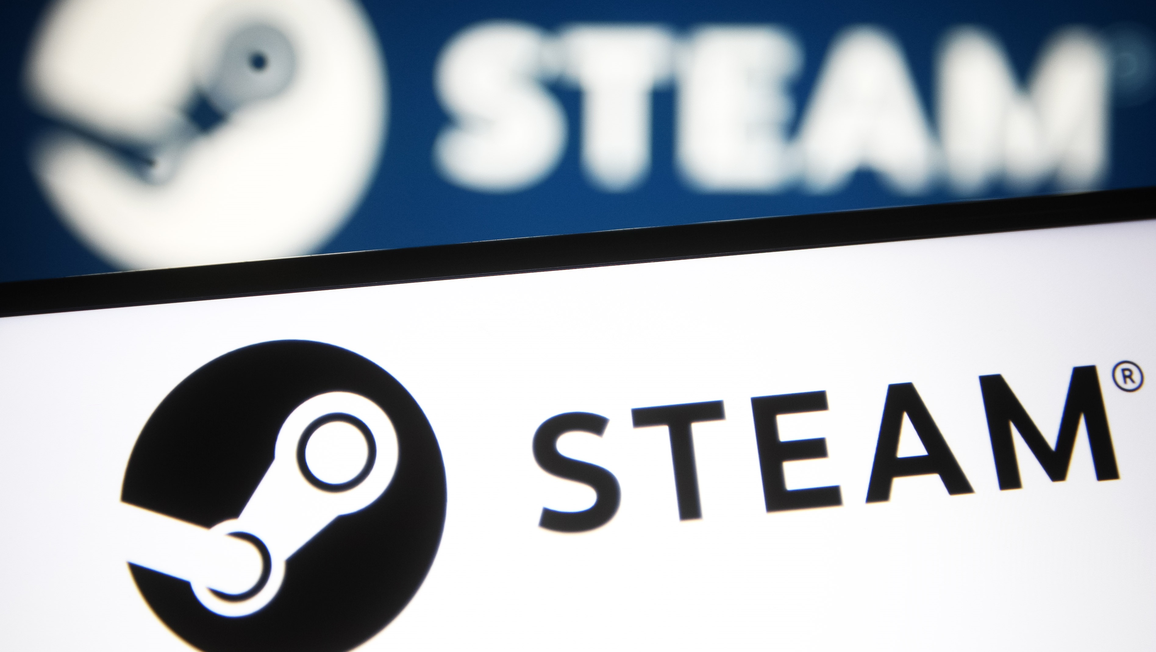 cff8bfeitmhmjb9tcer5cg-1 illustration a Steam logo of a video game digital distribution service is seen on a smartphone and a pc screen.