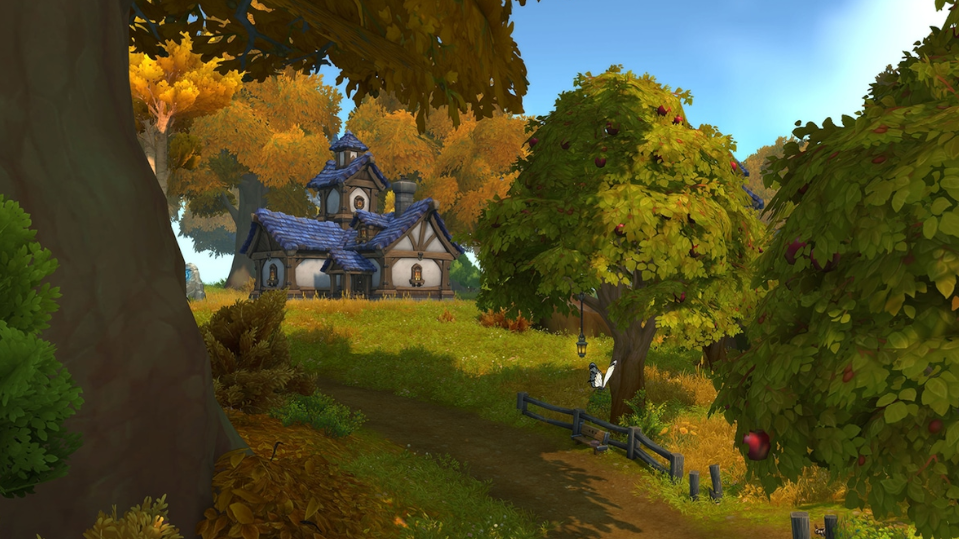 An image showing a player house in World of Warcraft, a cosy cottage placed upon a grassy hill in a verdant green forest.
