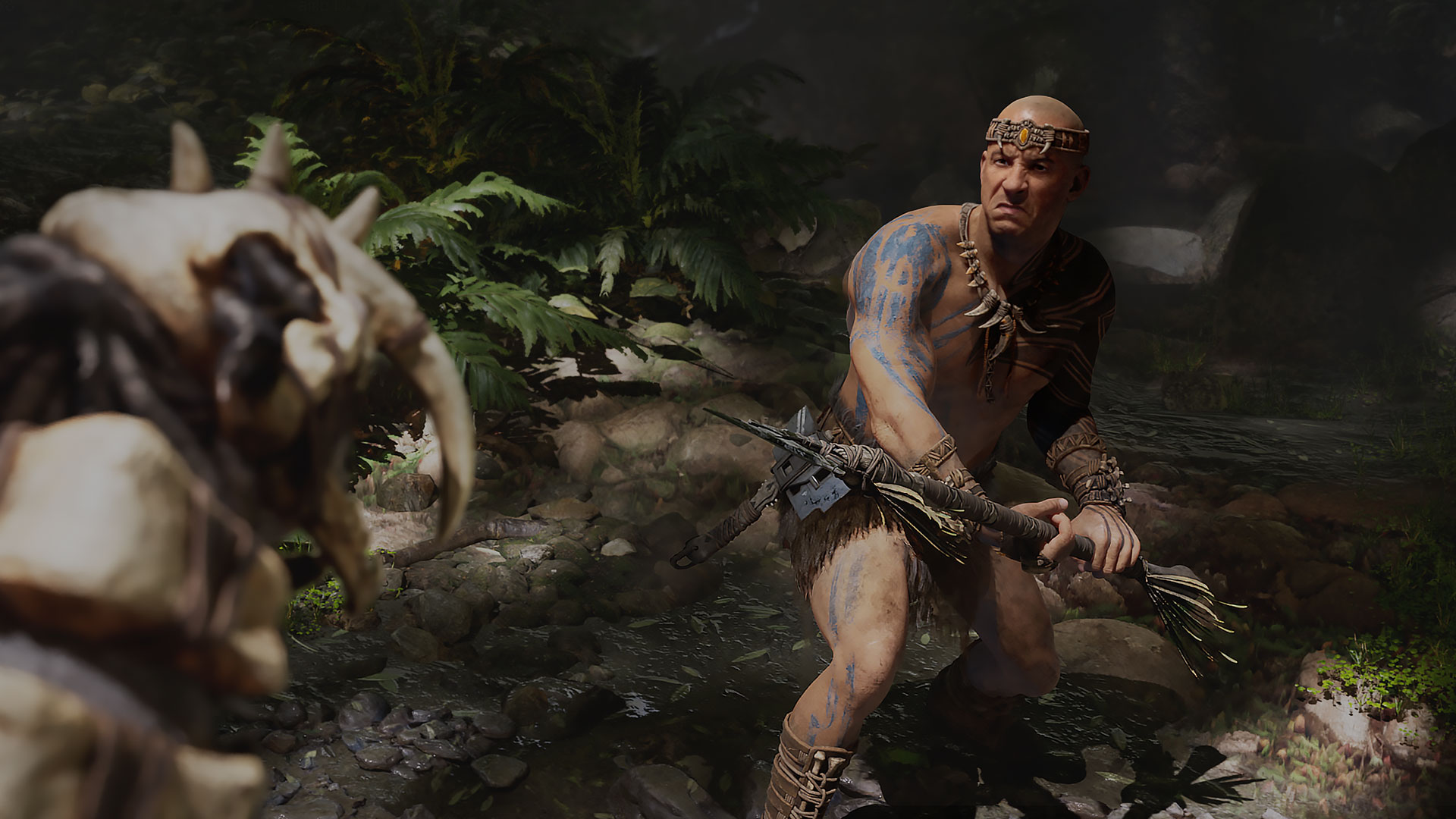 Ark 2 screenshot showing Vin Diesel holding a spear to fight back a dinosaur