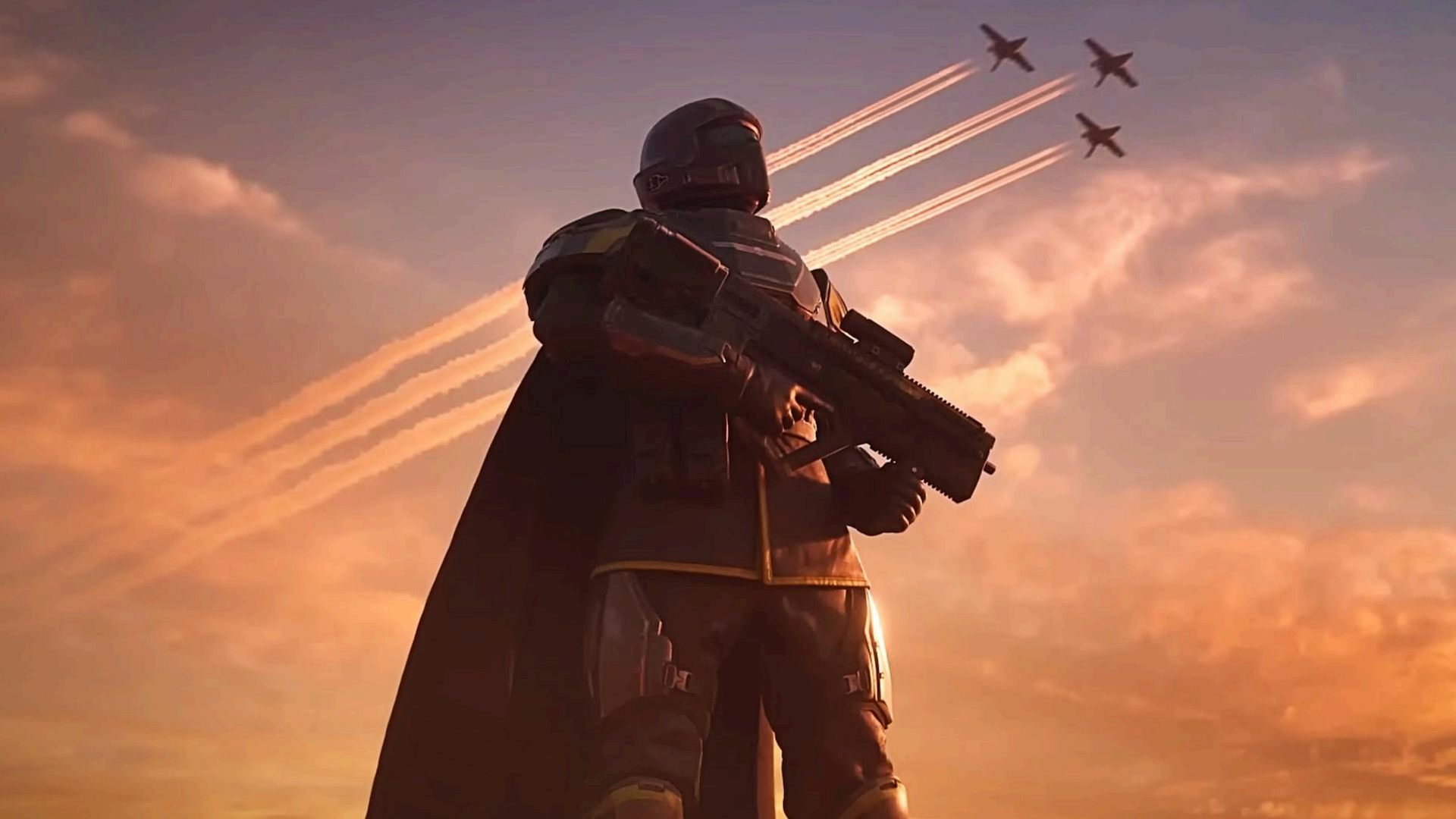 oyczakjs5jw4vmmgfeggqj-1 Helldivers 2 screenshot showing a fully geared/armored diver standing with gun in hand as three jets soar the skies behind him