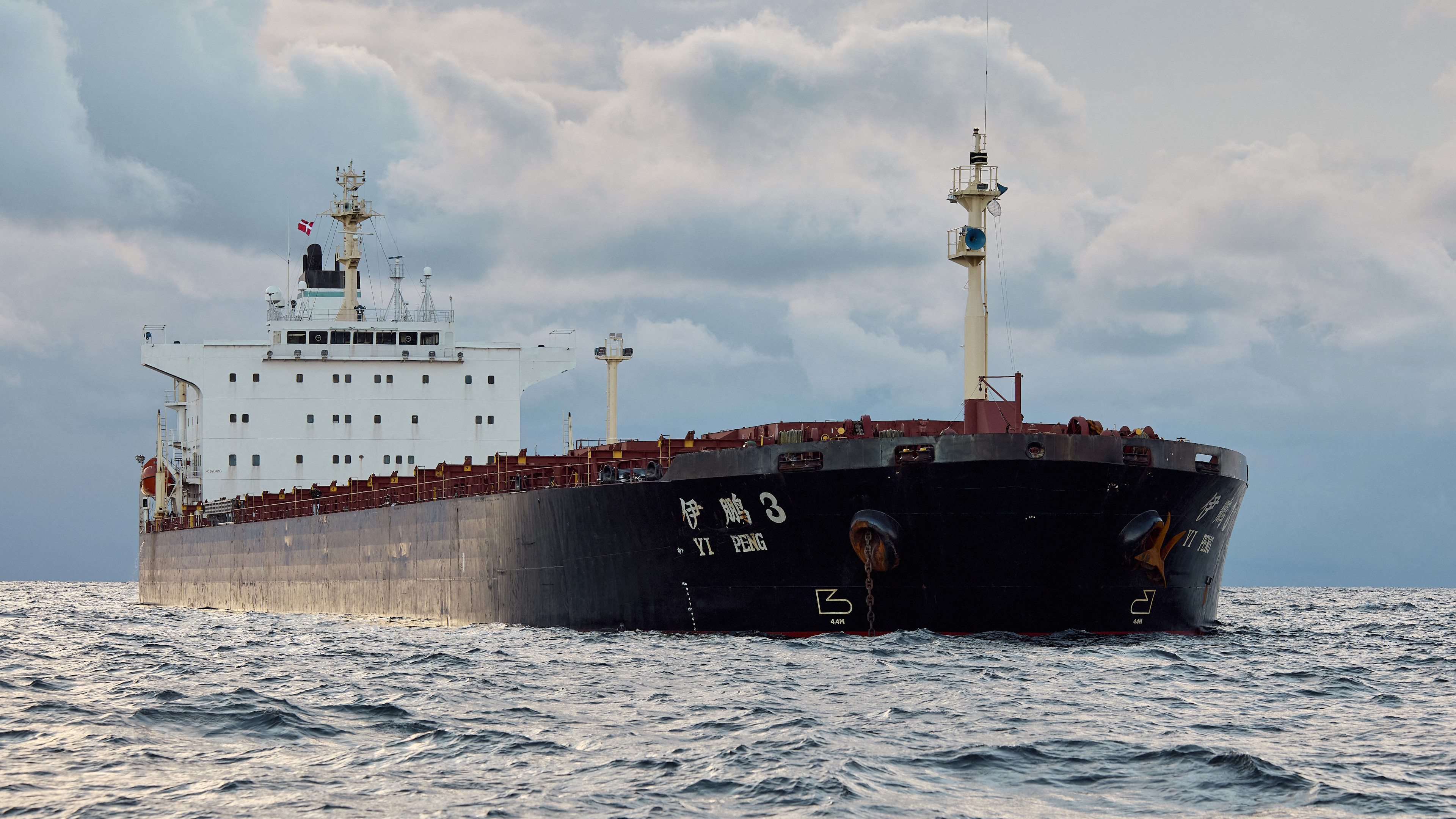The Chinese ship, the bulk carrier Yi Peng 3 is anchored and being monitored by a Danish naval patrol vessel (unseen) in the sea of Kattegat, near the City og Granaa in Jutland, Denmark, on November 20, 2024. Denmark's navy said on November 20, 2024 it was shadowing a Chinese cargo vessel in the Baltic Sea, a day after Finland and Sweden opened investigations into suspected sabotage of two severed undersea telecoms cables. &quot;The Danish Defence can confirm that we are present in the area near the Chinese ship Yi Peng 3,&quot; the military wrote in an email to AFP, adding that it would make no further comment for the time-being. (Photo by Mikkel Berg Pedersen / Ritzau Scanpix / AFP) / Denmark OUT (Photo by MIKKEL BERG PEDERSEN/Ritzau Scanpix/AFP via Getty Images)