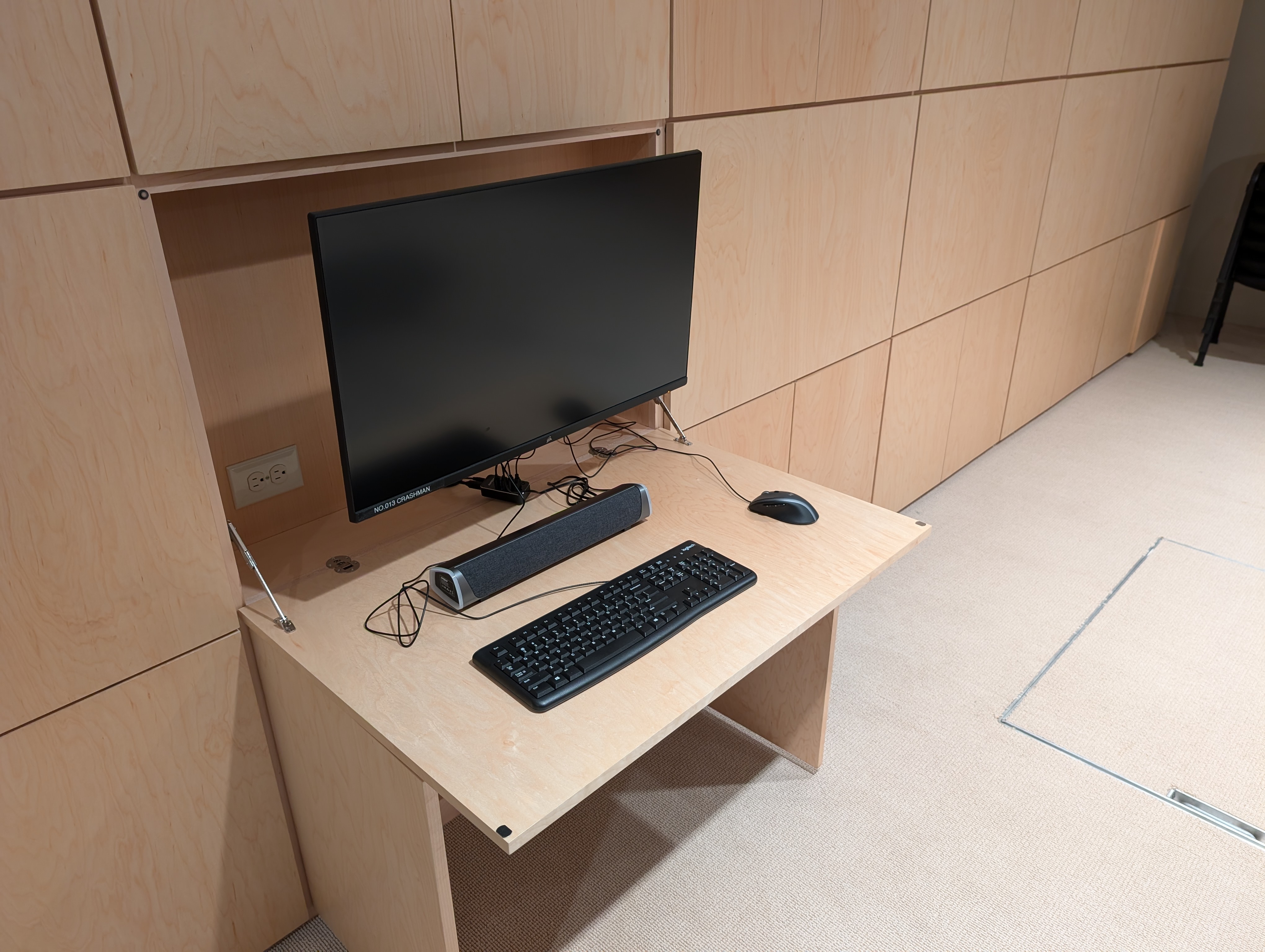 uhmgq2kizxemzca3sczku5 One of the LAN party house's 22 game stations, sitting on custom made, fold away wooden cabinetry.